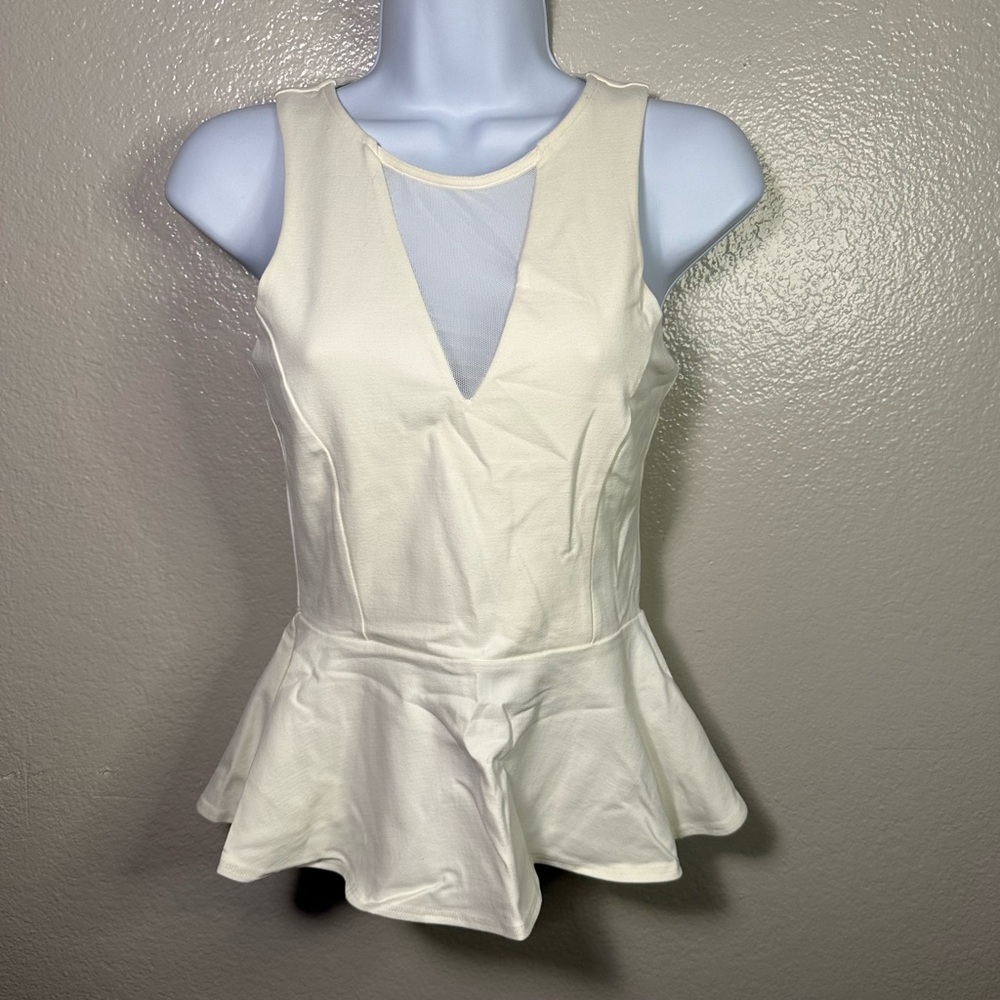 Bebe Keyhole Mesh Sleeveless Peplum Blouse in Ivory
